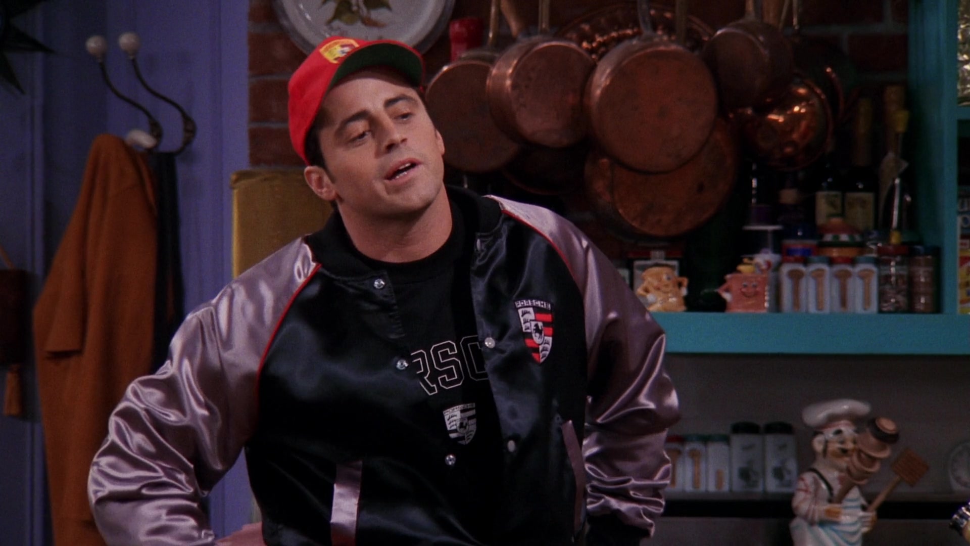 Porsche-Jacket-T-Shirt-and-Red-Cap-Worn-by-Matt-LeBlanc-Joey-Tribbiani-in-Friends-1